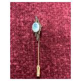 vintage gold-toned stickpin with enameled stone he