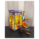 vintage-style Duck on Bike wind-up tin litho toy