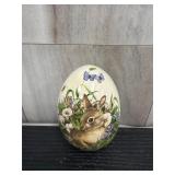 Glazed ceramic Easter egg with a brown bunny in a