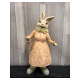 Country-style rabbit figurine wearing a peach dres