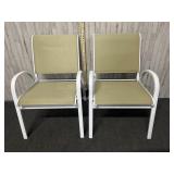 white metal and tan sling outdoor patio armchairs