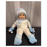 vintage soft-bodied baby doll wearing a white and