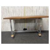heavy-duty wooden-topped workbench featuring a met