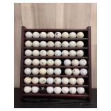Wall-mounted golf ball collection