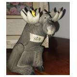 Moose with bird figurine
