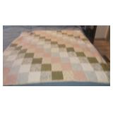 Homemade stitched patchwork baby quilt