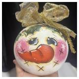 Hand painted snowman face ornament on large gourd