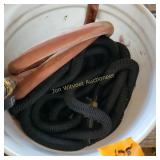 Bucket with garden hose