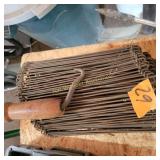 Bundle of dbl loop rebar tie wires with tool