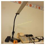 Desk lamp, adding machine