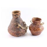 Lot of 2 Apache Pitch-Covered Baskets.