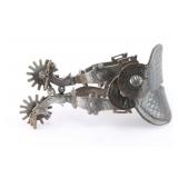 A Pair of E. Garcia Silver Overlay Spurs.