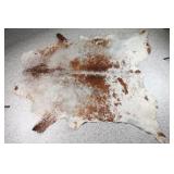 Brown and White Cowhide Rug