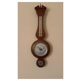 Vintage thermometer barometer with a Hydro meter