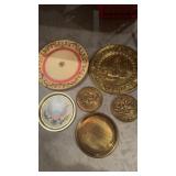 Large tole tray, and four brass trays, three