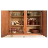 Kitchen cabinet with some wooden salad bowls