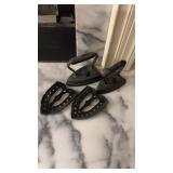 2 Antiques sad irons, with two matching stands,