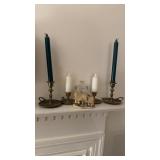 4 brass candlesticks with candles, a small, and a