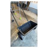 Grass cedar spreader, with large plastic wheels