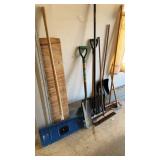 Two snow shovels, two push brooms, and two other