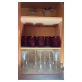 Kitchen cabinet with set of etched wine, glasses,