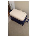 Igloo cooler with wheels in the back, pull up