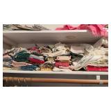 Shelf lot of vintage linens, mostly sets of