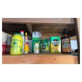 Garage lot that includes some miracle grow, stump