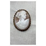 Antique and carved cameo brooch measures about 2