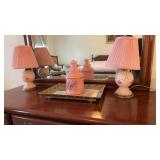 Two pink glass boudoir lamps, with a pink glass