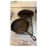 Two cast-iron frying pans, only one has a clear