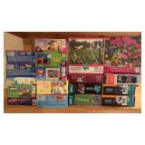 18 boxes of puzzles, some childrenï¿½s puzzles that