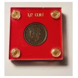 1857 US Half Cent in red case , marked NFSG