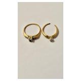 2 two 14 K gold rings with clear stones , first