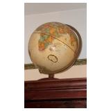 Vintage replugel world globe on a wooden metal