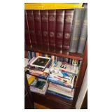 3 shelves of books, includes many National