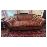 Nice antique sofa with rolled arms, swag drapes,