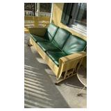 Antique metal glider, with a spring form base