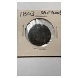 1803 US half cent coin, cracked into two pieces,