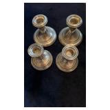 4 sterling silver candlesticks, all four have