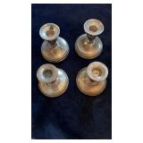 4 sterling silver candlesticks, all with weighted
