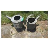 2 galvanized watering cans, one with a metal