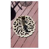 Ornate heavy umbrella stand on the back porch, 2