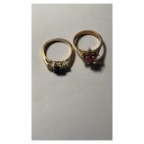 2 marked 14 K gold rings , both with stones , one