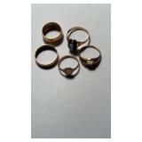 5 small 10 K gold baby rings , three or ring size
