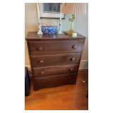 Four drawer dresser with a brown finish, measures