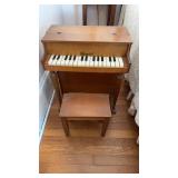 Antique Schuenhut childï¿½s piano with piano stool,