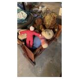 Vintage wood cradle filled with collection of
