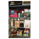 Three shelves of miscellaneous Christmas and