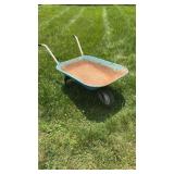 Small metal wheelbarrow, with a solid metal front